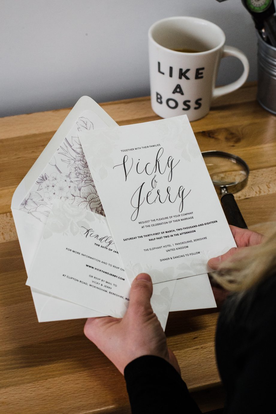 Amanda holds some sample wedding invitations made on her antique letterpress.