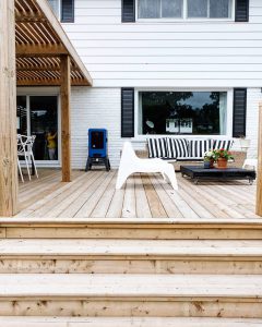 An outdoor living space with dining and living areas.