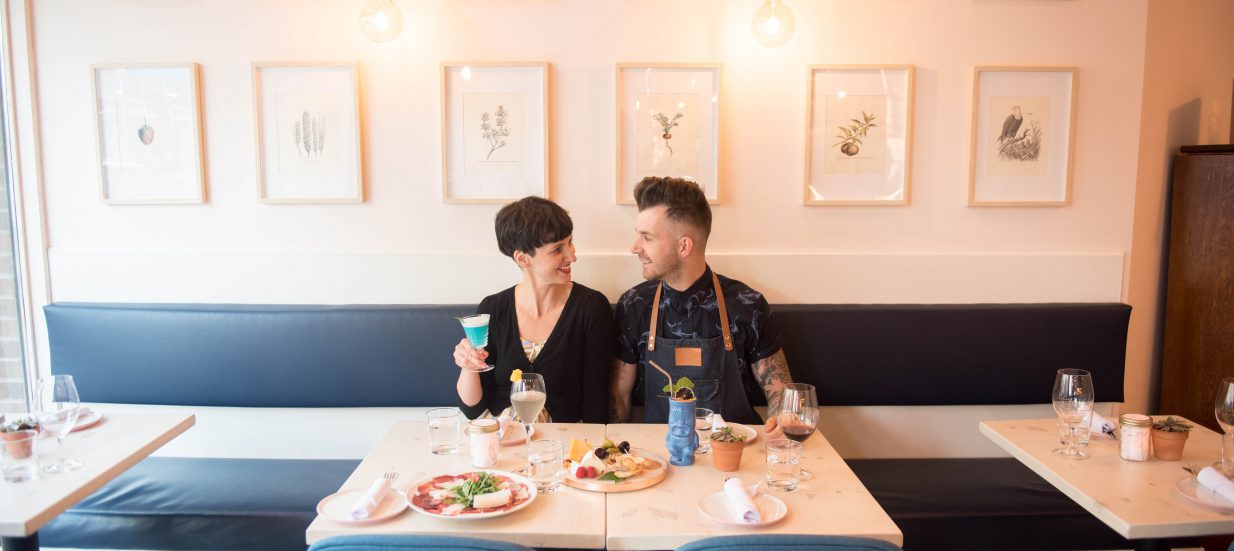 Alex Bruce and Celine Lepage enjoying a drink at their restaurant and winebar, The Lark, in downtown Belleville.