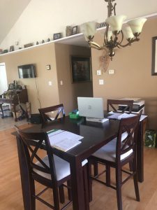 A living room table in a large room.