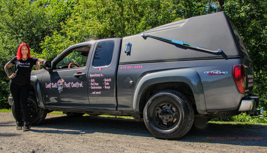 A person standing next to a truck with text: "Last Call Pest Control"