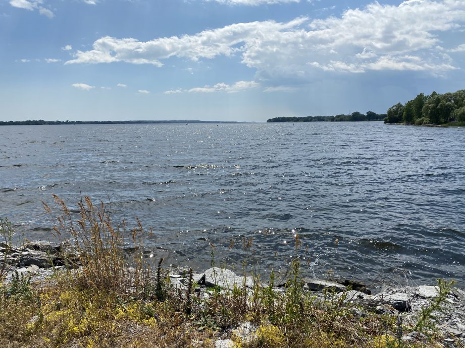 A lake with the sky in the background.