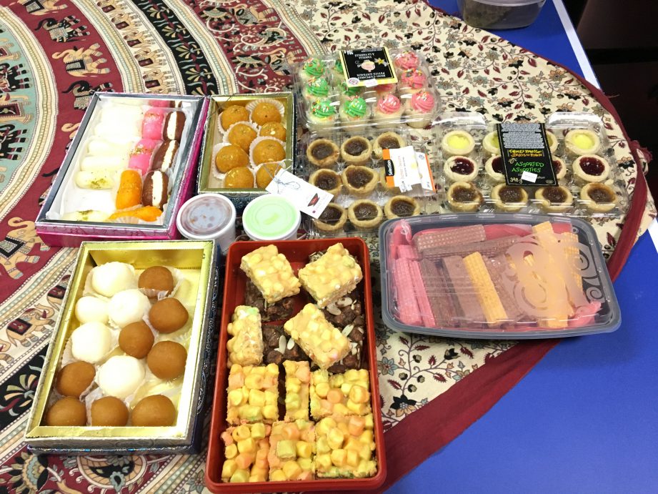 Trays of desserts on a table.