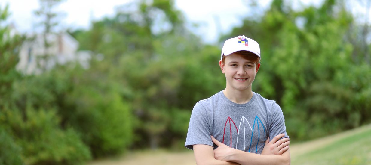 A person standing with their arms crossed