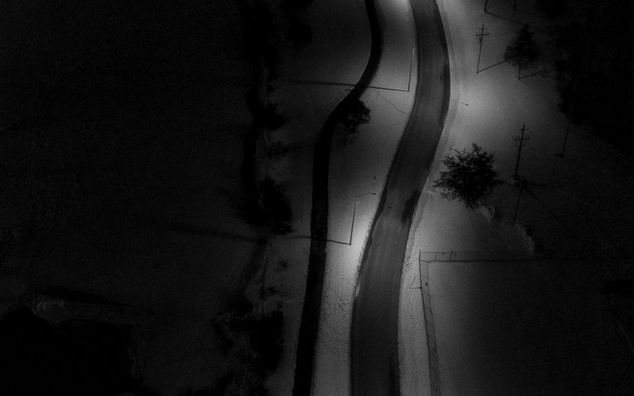 Aerial black-and-white photo of two trails.