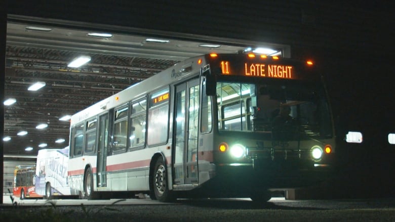 A Belleville city transit bus at night.