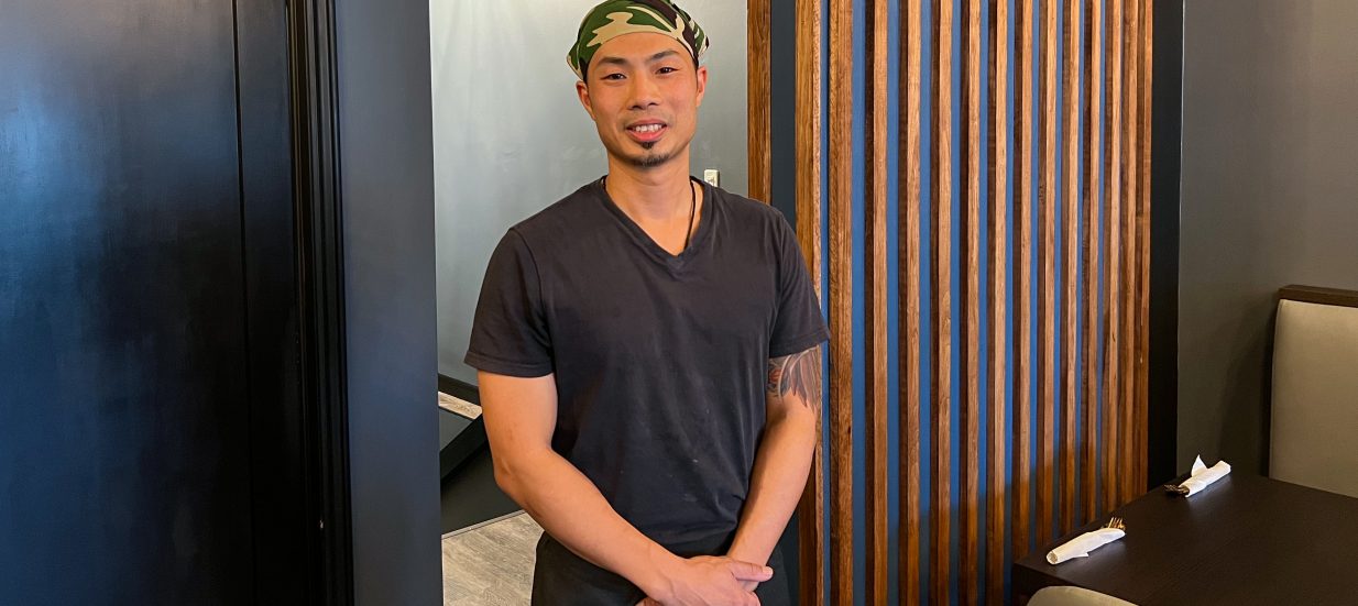 David Yeung, owner of Fool's Kitchen in Downtown napanee, stands posed in his restaurant.