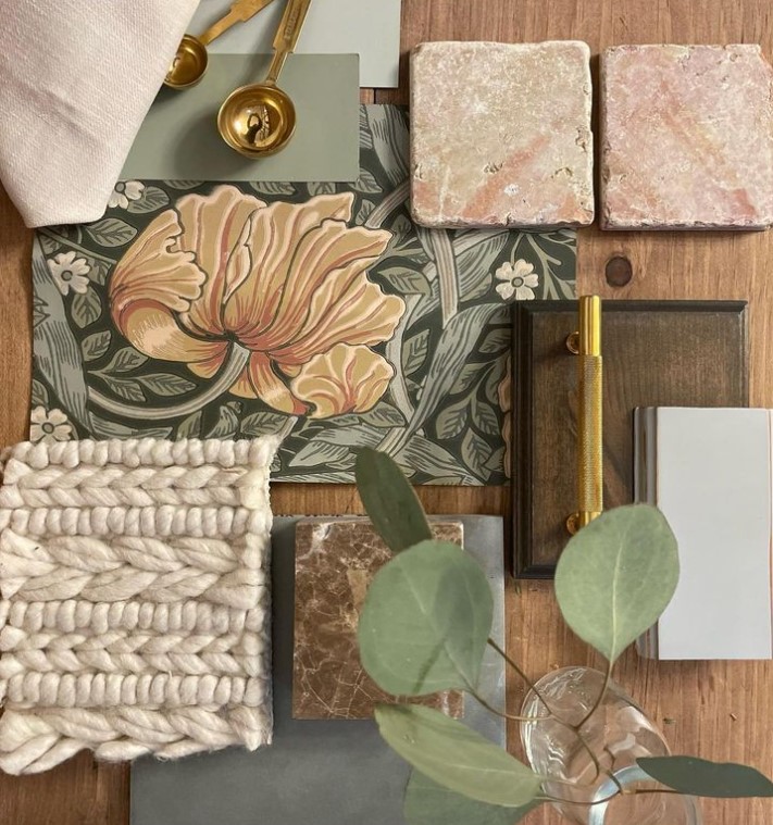 A flat lay of interior design elements with various textures and natural colours: tiles, plans, fabrics and other finishes